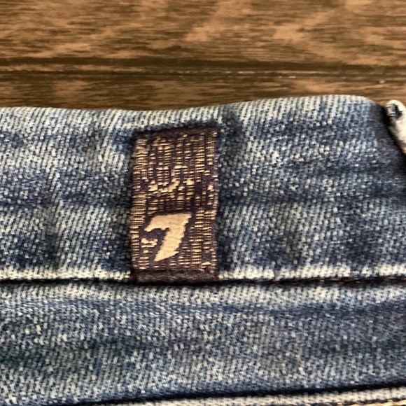 7 for all mankind boot cut flare jeans. Size 27. Medium wash. Faded front. - Picture 13 of 16